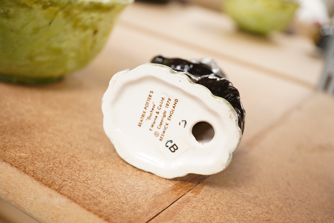 A Beatrix Potter, stamped F Warne and Co Ltd, Beswick figure of “Duchess” with pie, 10cm high.